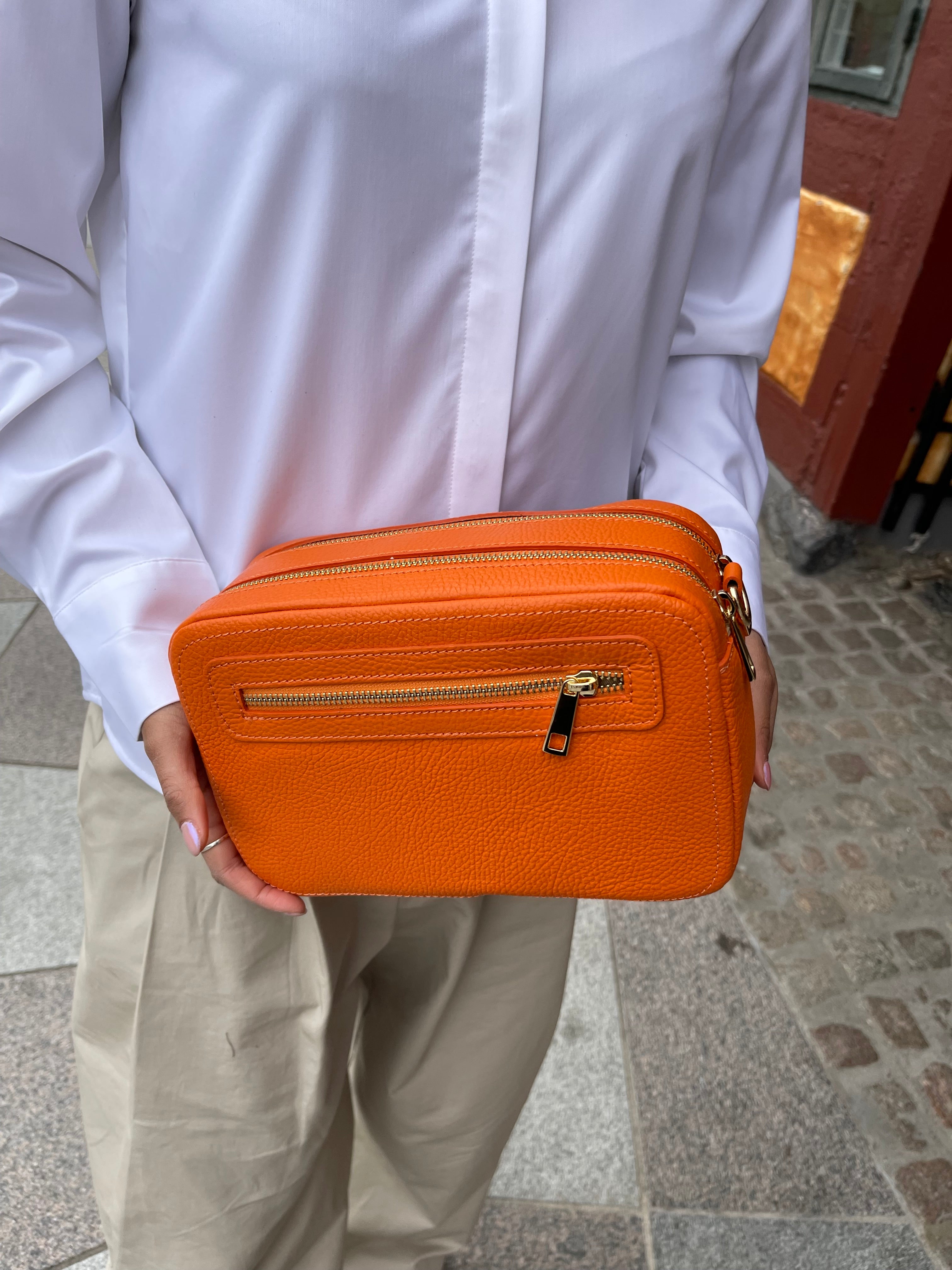 Orange clutch med double rum